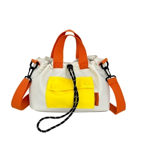 Three-color contrast nylon bucket bag with drawstring closure and adjustable crossbody strap