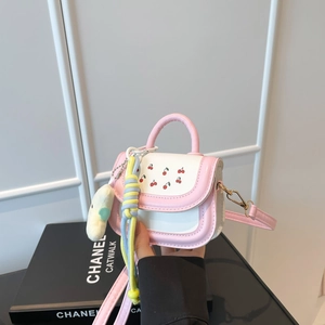 Pink and white girl's mini handbag with cherry pattern and colorful charm decoration