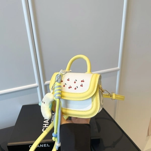 Mini crossbody bag for girls with cherry print and banana plush charm on white grid