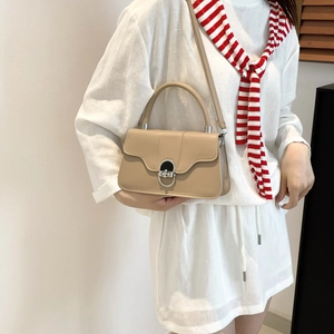 Chic beige crossbody bag with U-shaped metal buckle and premium faux leather finish
