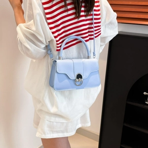 Minimalist light blue leather crossbody bag with silver ring clasp for commuting women
