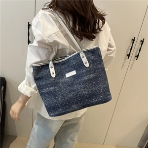 Deep blue denim tote bag with white polka dots and silver leather handles for women