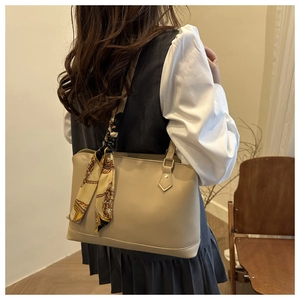 Detail of light khaki tote bag with vintage printed silk scarf and adjustable strap