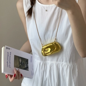 Golden mirror finish bean-shaped clutch bag with delicate metal chain strap for women