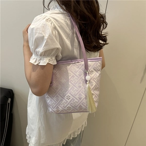Elegante borsa tote jacquard viola con motivi floreali e nappa alla moda da donna