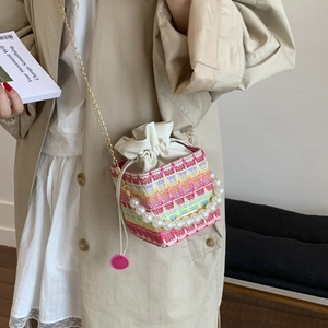 Colorful crochet mini bucket bag with pearl handle and golden chain crossbody strap
