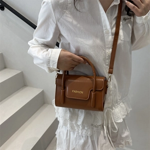 Minimalist brown crossbody square bag with gold FASHION text and round top handle
