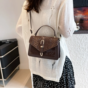 Brown snake pattern embossed leather handbag with metal buckle and shoulder strap