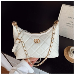 Detail of white quilted hobo bag with gold chain strap and interlocking metal hardware