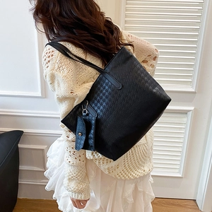 Large capacity black tote bag with houndstooth texture and matching mini pouch