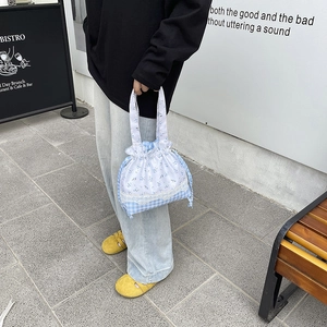 Floral and gingham drawstring lunch tote bag with lace detail and comfortable handle