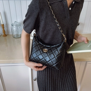 Classic black quilted shoulder bag with gold hardware and elegant leather chain strap