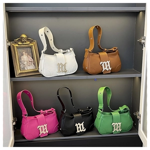 Detail of five PU leather baguette bags with gothic M logo in silver finish and adjustable straps