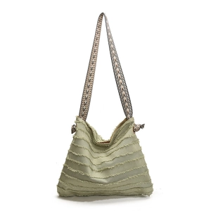 Retro light green pleated tote bag with geometric woven strap and frayed canvas details