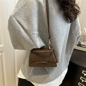 Chic dark brown lychee leather crossbody bag for women in a minimalist square design