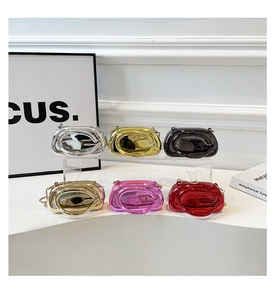 Collection of acrylic evening clutch bags with metallic finish and round ring handles