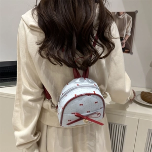 Mini travel backpack for girls with red bowknot prints and heart gold pendant charm