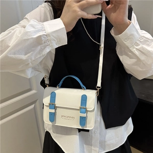 Retro white PU leather shoulder bag with blue handles and gold buckle details