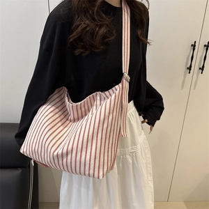 Red and white vertical striped canvas crossbody bag for women in casual daily style