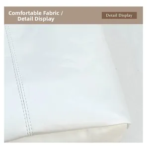 Macro shot of durable white faux leather fabric with precise double-row stitching detail