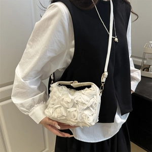 Elegant white floral evening bag with 3D rose petals and gold chain crossbody strap