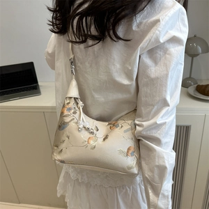Beige satin shoulder bag with Chinese embroidery and white bead drawstring detail