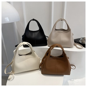 Detailansicht von vier strukturierten Leder-Eimertaschen in Schwarz, Apricot, Weiß und Braun