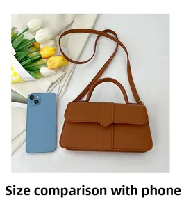 Brown rectangular crossbody bag shown next to a smartphone to demonstrate actual size