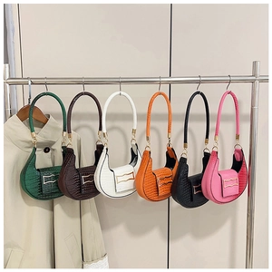 Close-up of semi-circular underarm bags in six colors with crocodile leather texture