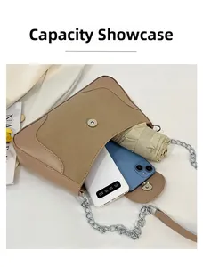 Internal view of khaki saddle bag showing capacity for phone and folding umbrella