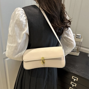 Minimalist cream white underarm bag with gold metal buckle and elegant curved base