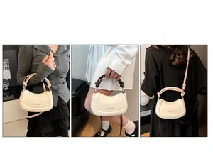 Chic cream crescent bag with woven handle and Amiu 1985 text, versatile carrying options