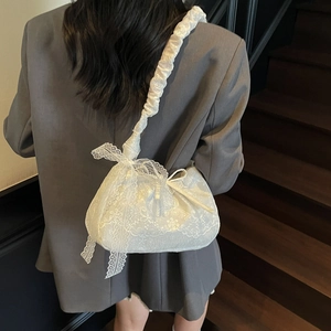 Summer 2025 white lace tote bag with floral patterns and bow strap on shoulder