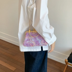 Elegant lavender rose petal handbag with gold handle and chain strap for evening events