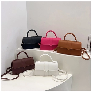 Front view of colorful square crossbody bags in leather with V-shaped stitching detail