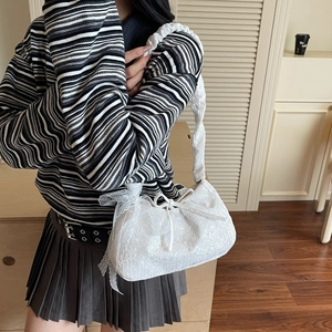 Fashionable white lace embroidery tote bag with bow detail and pleated handle on model