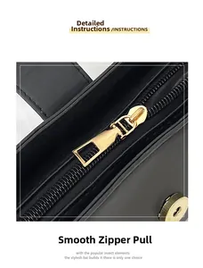 Dettaglio macro della cerniera dorata e chiusura magnetica su borsa in pelle nera