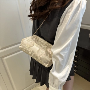 Champagne gold embroidered floral bucket bag with metallic chain strap for formal events