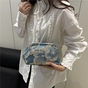 Elegant blue satin shell bag with white floral embroidery and gold chain strap