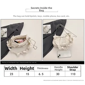 Tableau des tailles et guide de capacité pour ce sac à bandoulière blanc plissé nuage