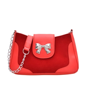 Red saddle bag for women with leather patchwork and silver metallic bow detail