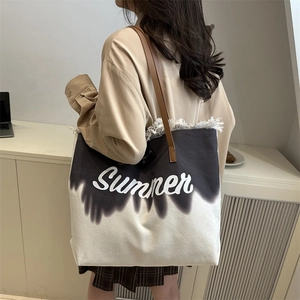 Grand sac fourre-tout en toile avec dégradé noir et blanc et détails à pompons chic