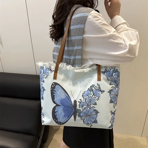Sac fourre-tout en toile avec imprimé papillon bleu et détails de franges vintage