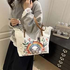 Sac cabas en toile blanche avec imprimé arc-en-ciel et papillon et anses en cuir