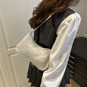 Sparkly silver sequin baguette shoulder bag for women with a sleek Y2K party style design