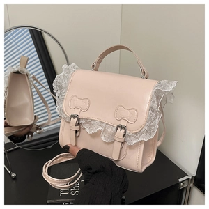 Detail of pink PU leather bag featuring white lace trim and bow knot decoration