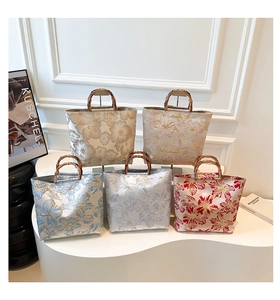 Detailed collection of five floral jacquard tote bags with natural bamboo handles