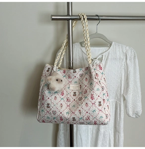 Quilted floral tote bag with pink bear motifs, woven rope handle and star plush charm