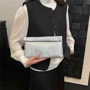 Silver snakeskin textured envelope clutch bag with minimalist folding top design