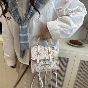 Women's cream mini backpack with cute animal floral print and gold metal logo detail